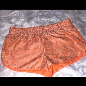 Salmon colored lace material shorts. Juniors L